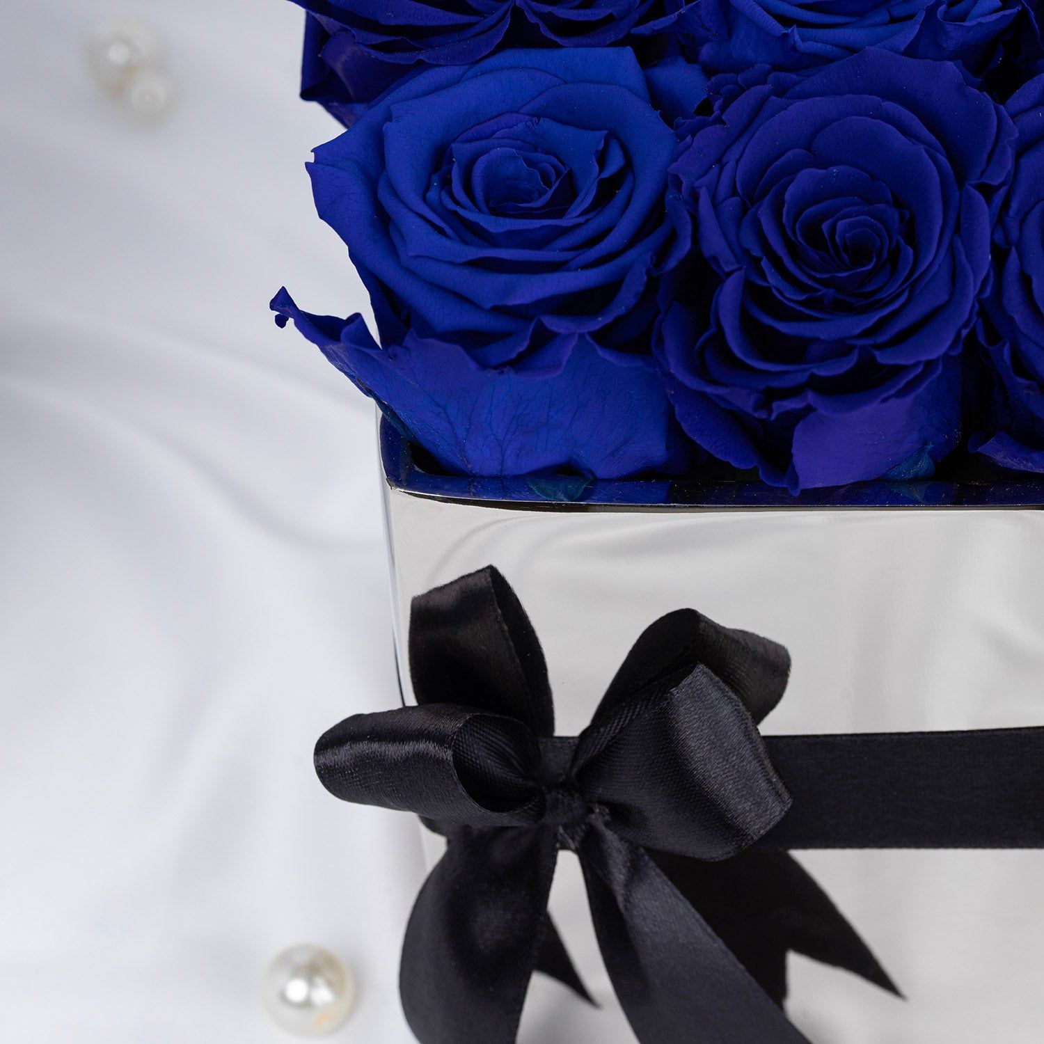 Elegant Blue Forever Roses in Luxurious Silver Vase