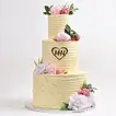 Elegant Three-Tier Wedding Cake with Floral Accents