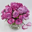 Elegant Arrangement of Purple Roses in a Glass Fish Bowl