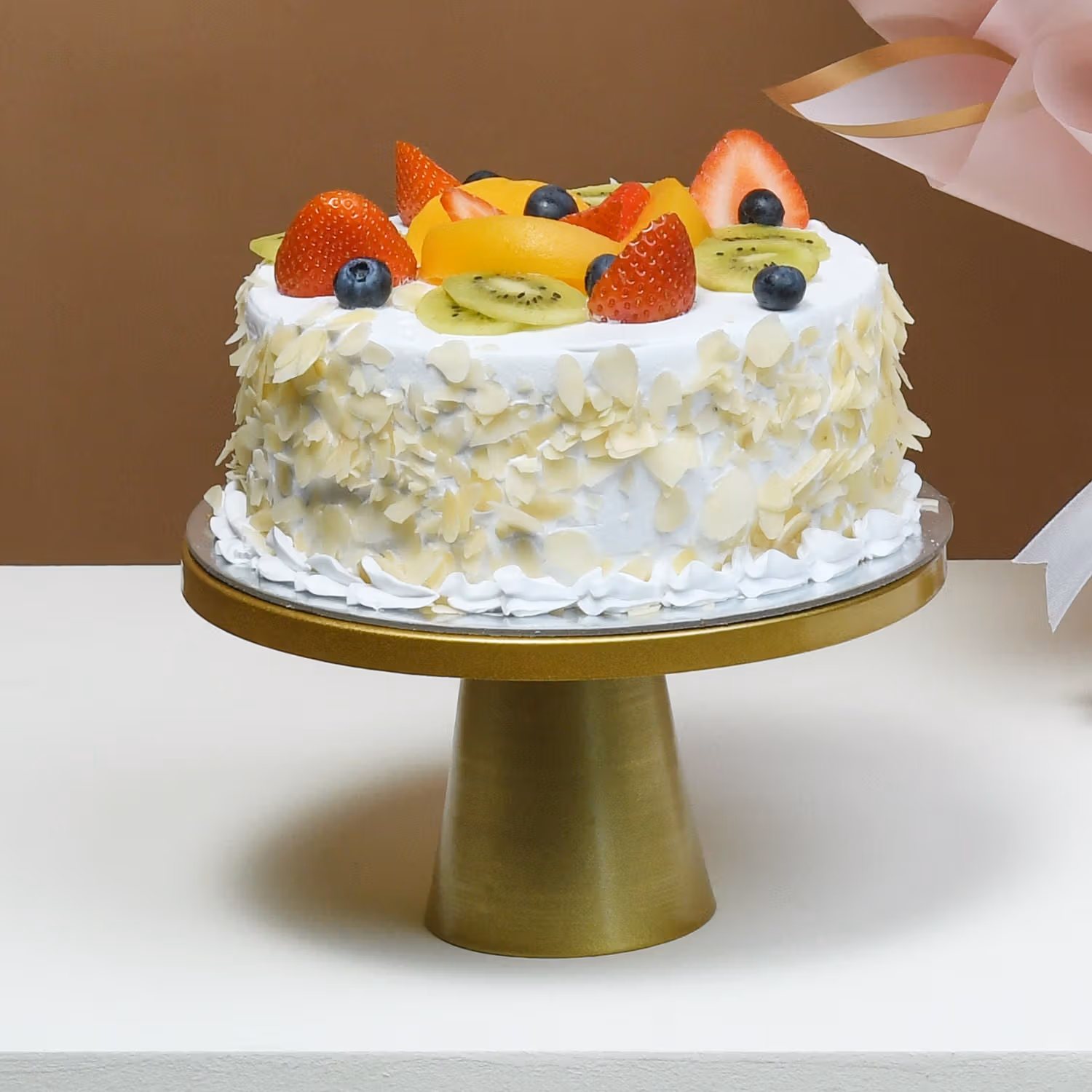 Whispering Love: A Delightful Bouquet and Fresh Fruit Cake Combo