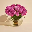 Elegant Arrangement of Purple Roses in a Glass Fish Bowl