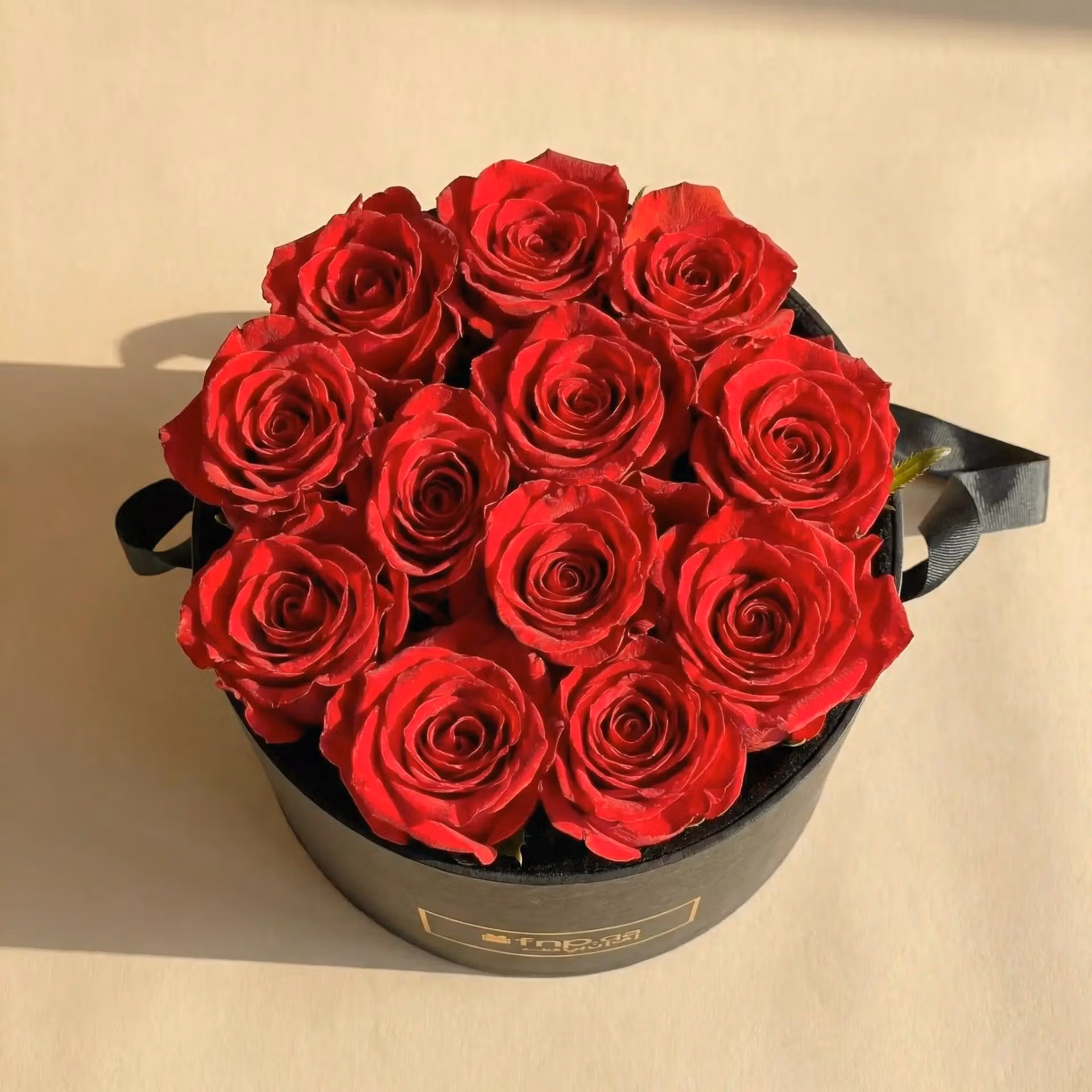 Luxurious 12 Red Roses in Elegant Black Round Box