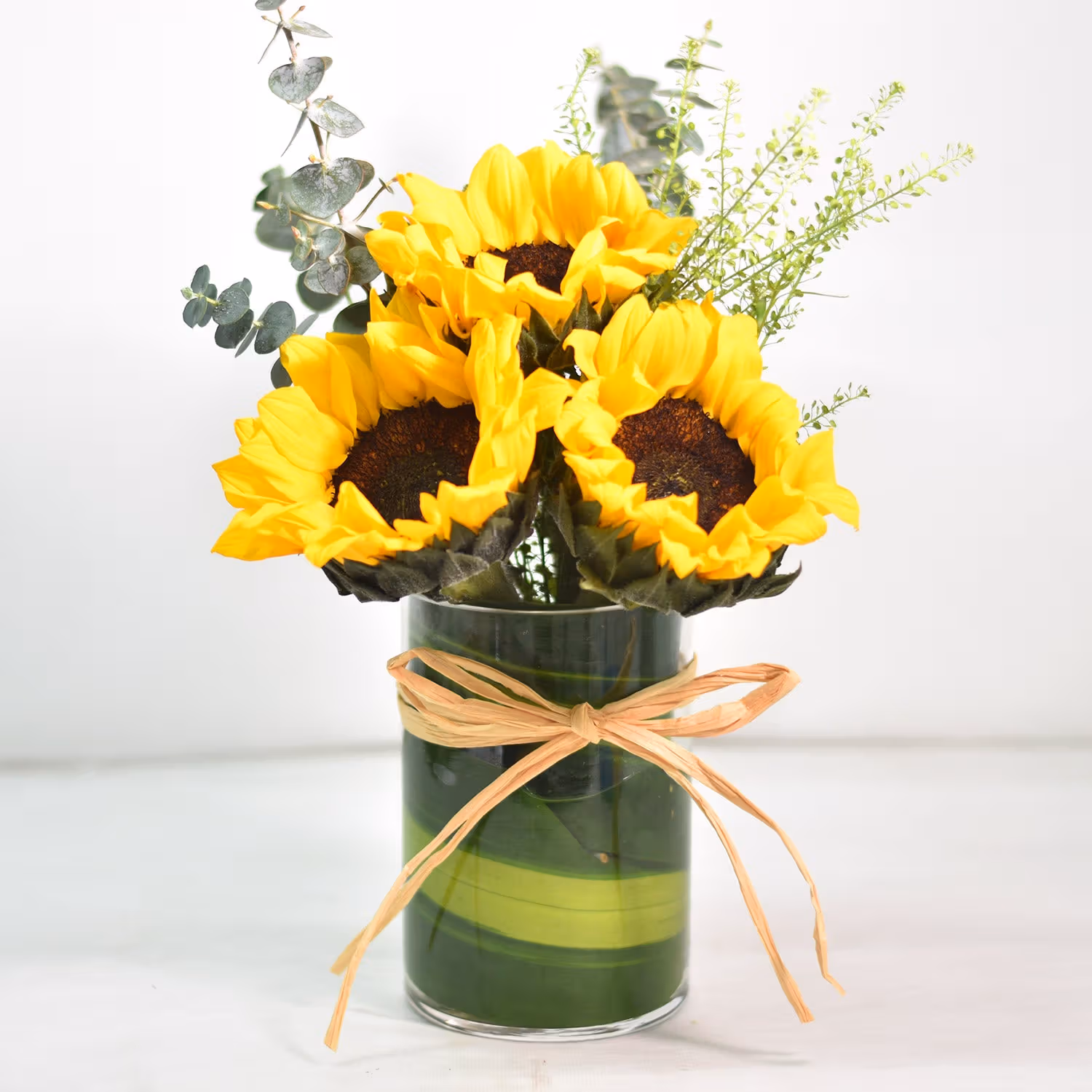 Lovely Sunflowers in Round Glass Vase