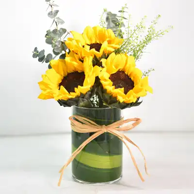 Lovely Sunflowers in Round Glass Vase