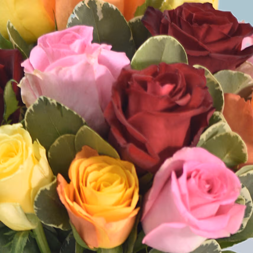 Mixed Roses Arrangement In A Glass Vase