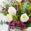 Elegant White Tulip and Wax Flower Arrangement in Glass Vase