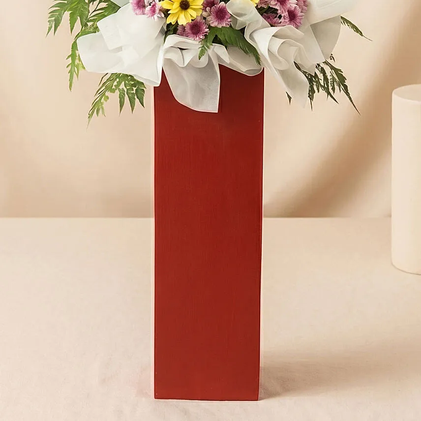 Gerberas Purple Pom In Beautiful Red Stand