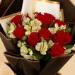 Red Roses And Alstroemeria In Black Wrapping For Graduation