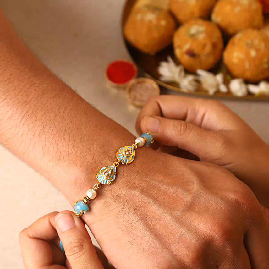 Sneh Designer Blue Stone Rakhi & Ferrero Rocher
