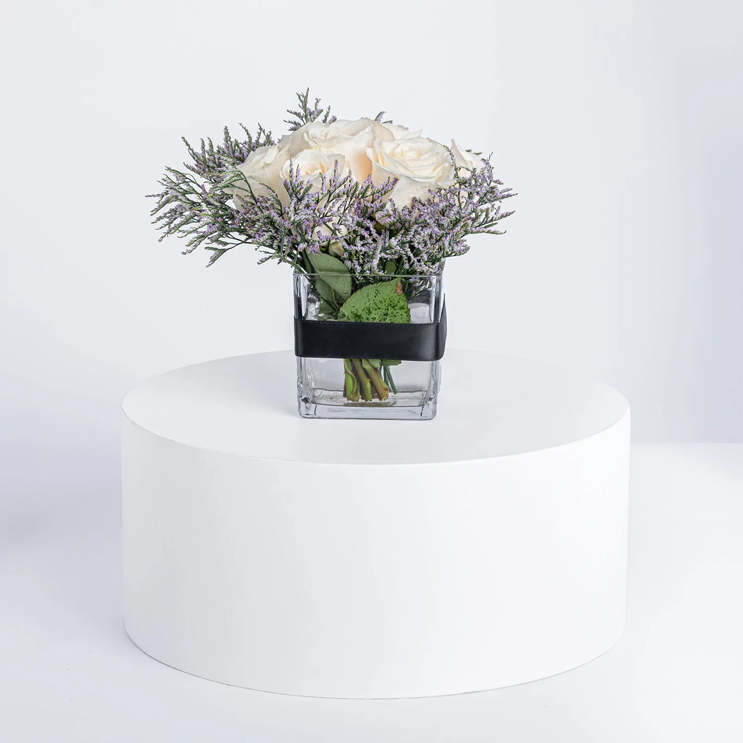Elegant Arrangement: 9 White Roses in a Glass Vase