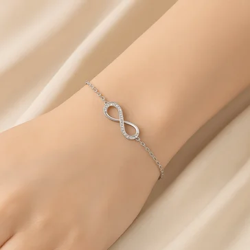 Elegant Infinite Charm Silver Bracelet with Pink Roses Under Glass Dome