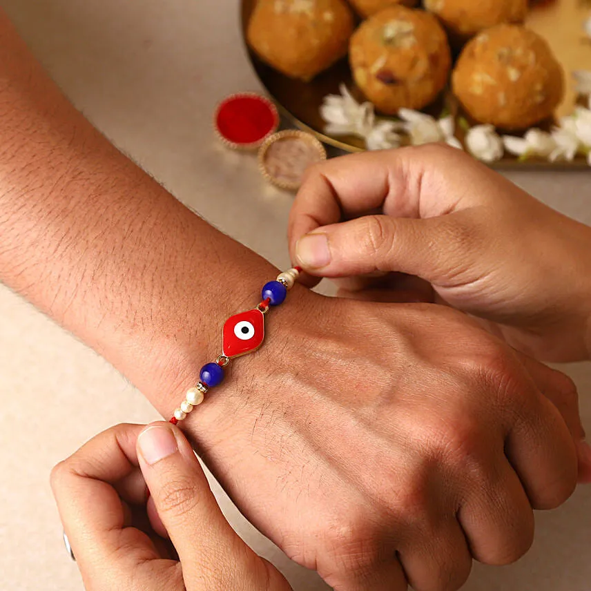 Sneh Evil Eye Red Rakhi & Lindt Bar