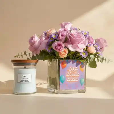 Blooming Bliss: Elegant Floral Arrangement with Magnolia Birch Candle