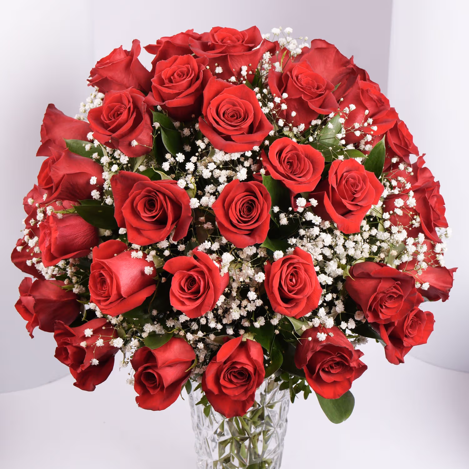 Luxurious Bouquet of 50 Scarlet Red Roses with Elegant Fillers in a Glass Vase