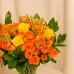 Orange And Yellow Rose Arrangement In A Vase For Graduation