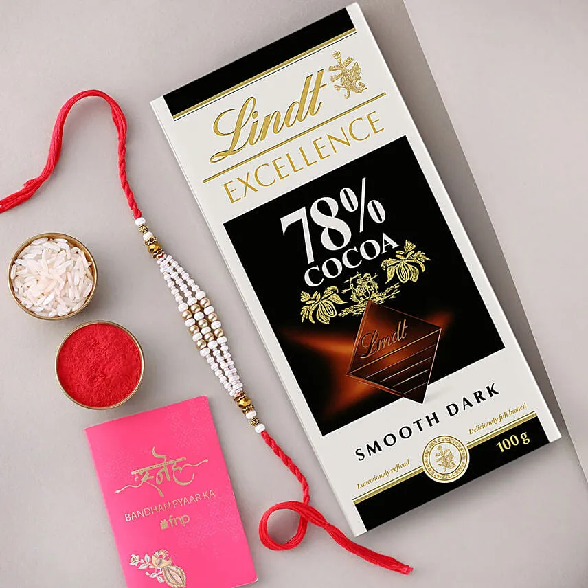 Sneh White Pearl Bead Rakhi with Lindt Extra Creamy Milk Chocolate