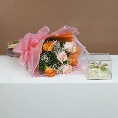 Elegant Bouquet of Orange and Peach Roses with Delightful Fruit Cake