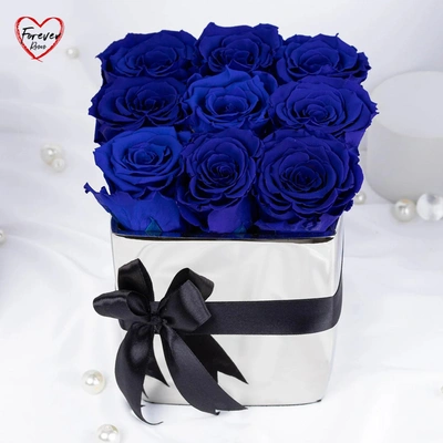 Elegant Blue Forever Roses in Luxurious Silver Vase