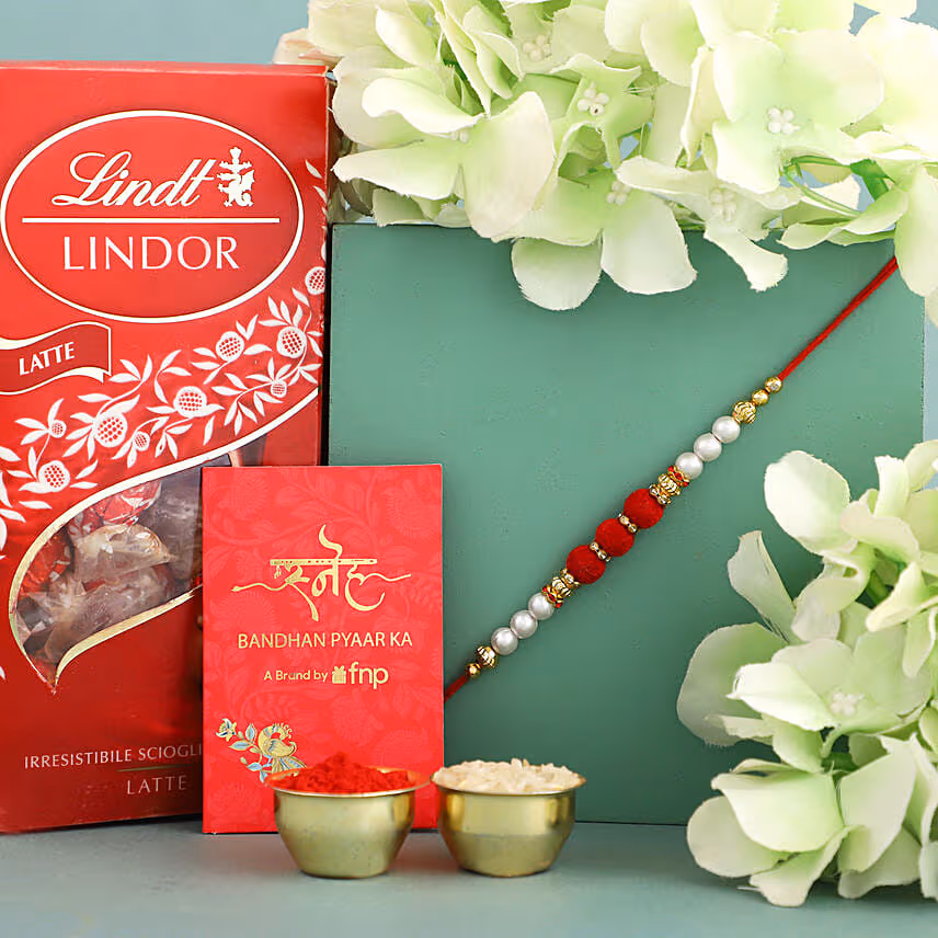 Sneh Red White Pearl Rakhi & Lindor Chocolate