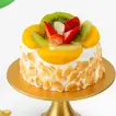 باقة البالونات وكعكة الفواكه اللذيذة