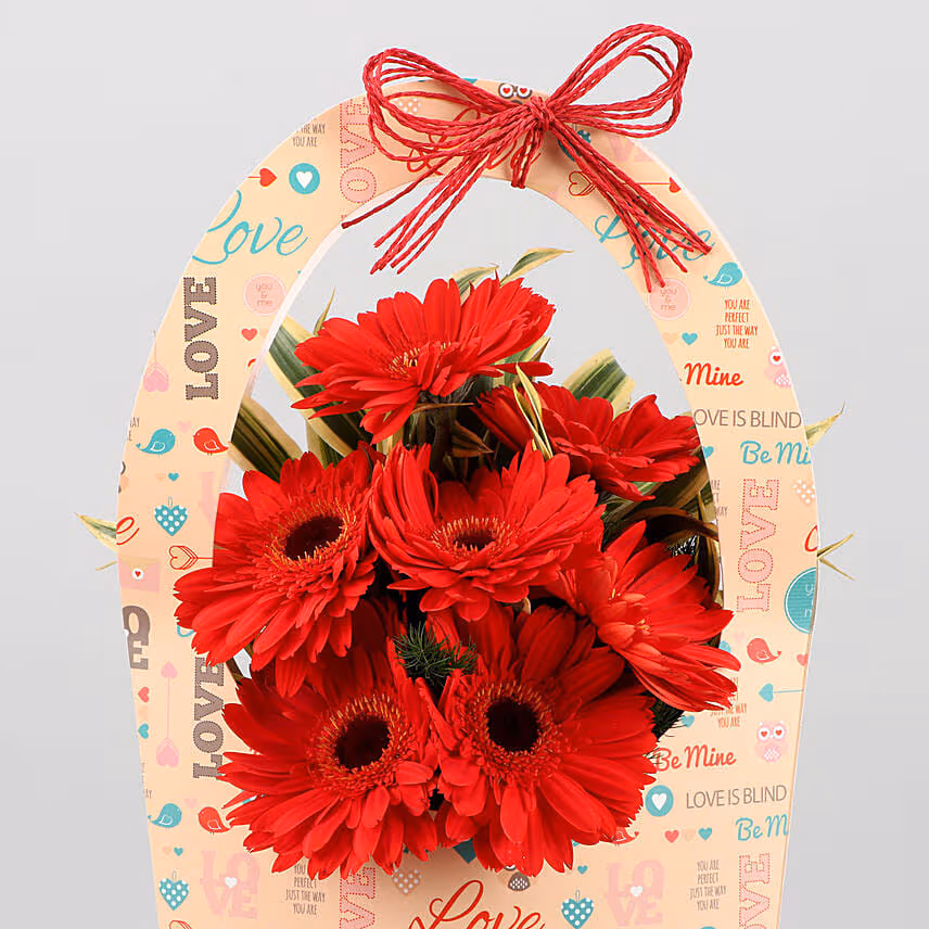 Red Gerberas In FNP Love Sleeve