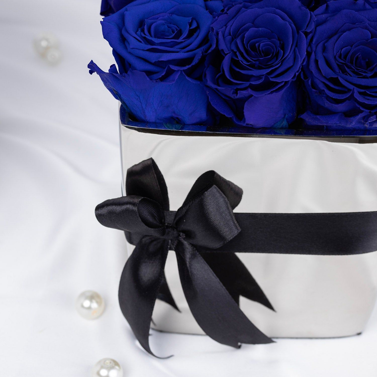 Elegant Blue Forever Roses in Luxurious Silver Vase