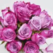 Elegant Arrangement of Purple Roses in a Glass Fish Bowl