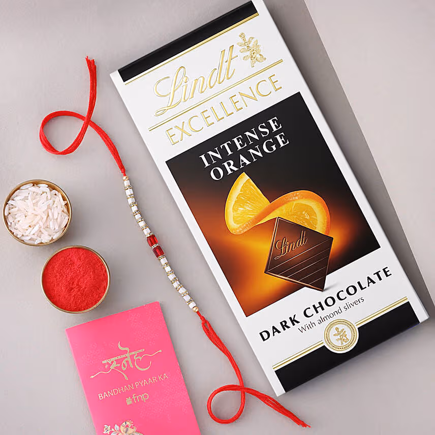 Sneh White and Red Bead Rakhi with Lindt Extra Creamy Milk Chocolate