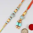 Elegant Blue Stone Rakhi Set and Delightful Soan Papdi Combo