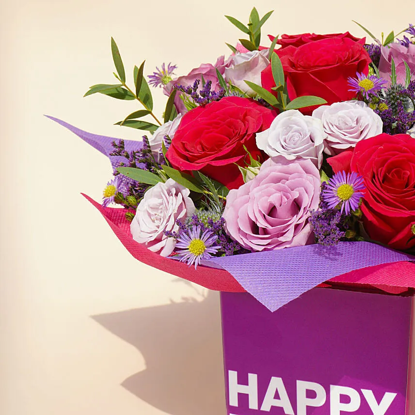 Mixed Flowers In a Square Glass Vase