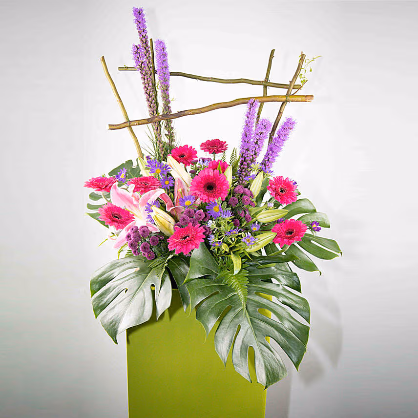 Alluring Mixed Flowers Green Cardboard Stand