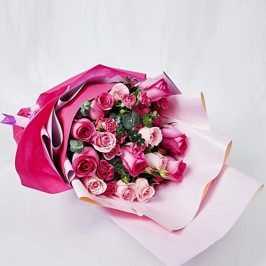 Magnificent Mixed Roses Wrapped Bouquet With Chocolate