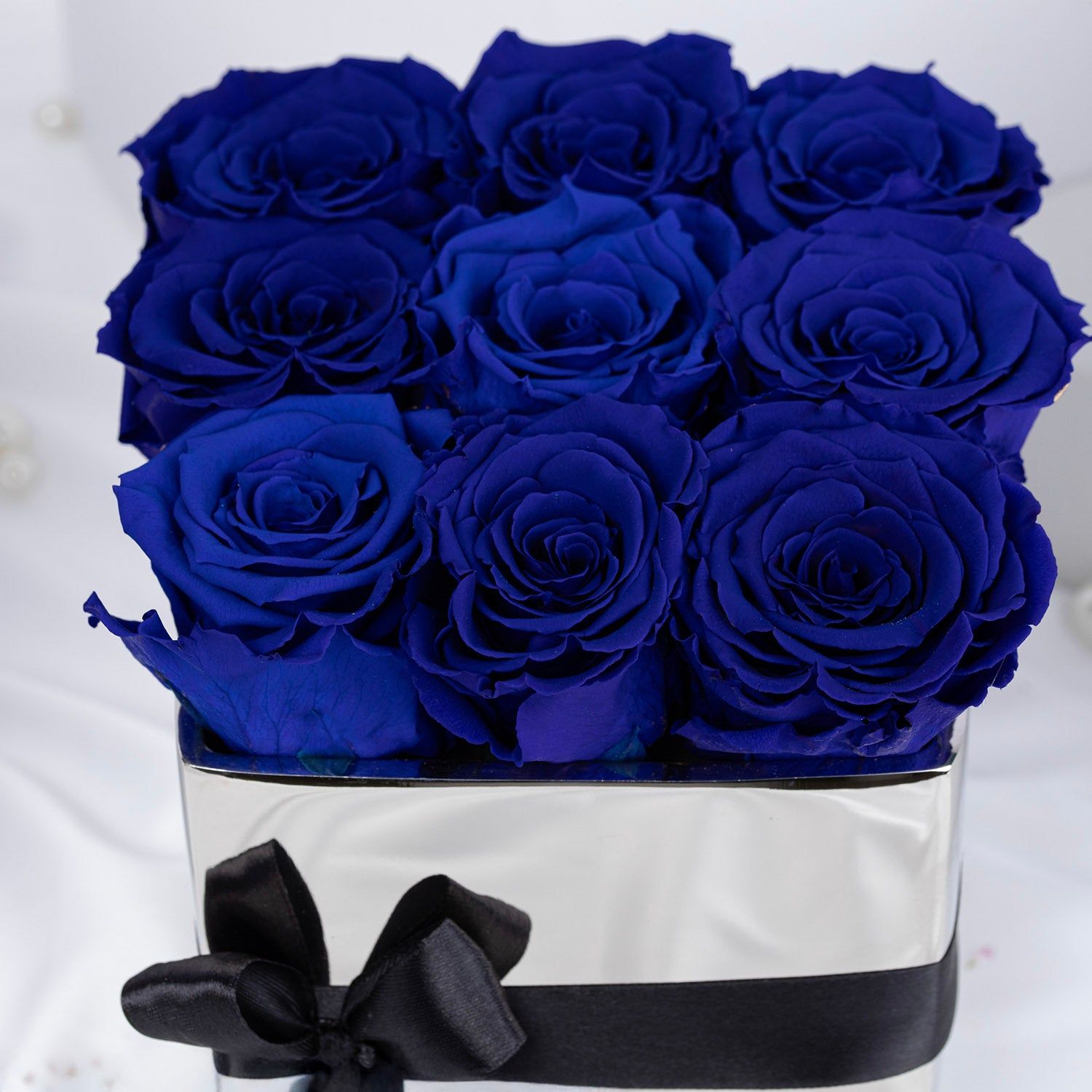 Elegant Blue Forever Roses in Luxurious Silver Vase