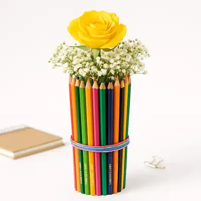 Vibrant Yellow Rose and Pencil Bouquet: A Creative Floral Arrangement