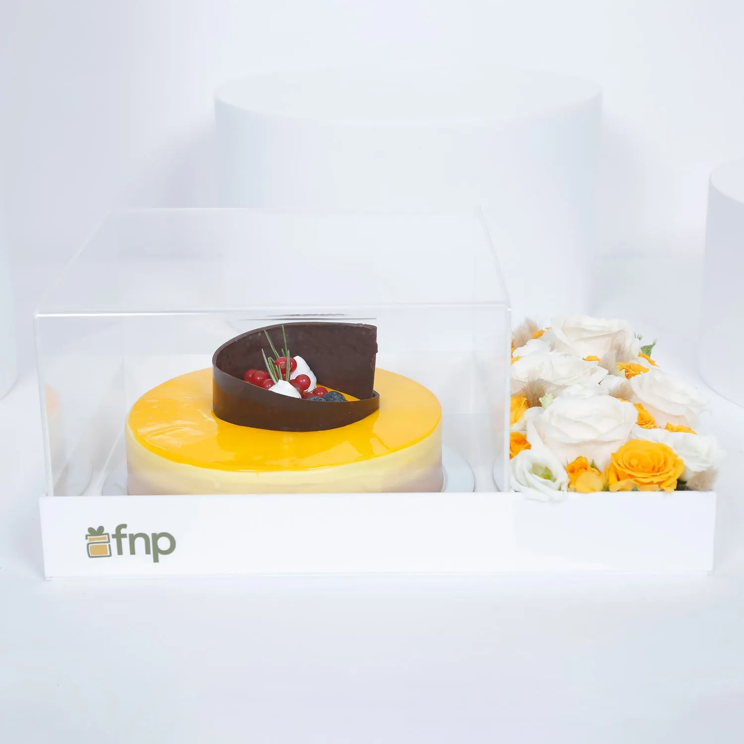 Exquisite Tropical Mango Tango Cake with Elegant Floral Arrangement