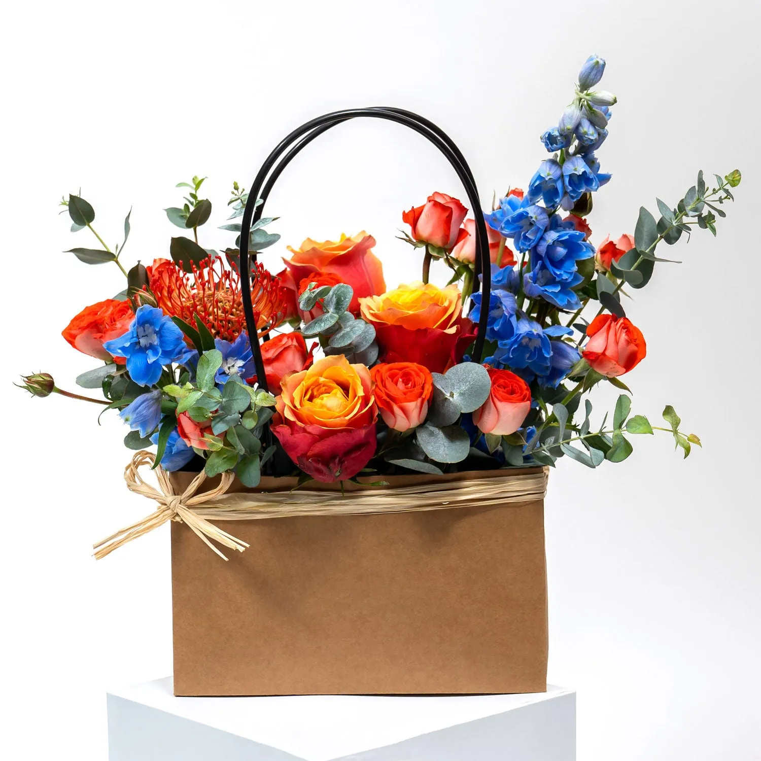 Elegant Floral Arrangement with Luxurious Chocolate Box