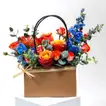 Elegant Floral Arrangement with Luxurious Chocolate Box