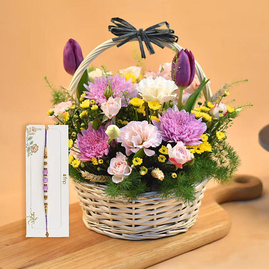 Striking Mixed Flowers Round Basket With Purple Pearl Rakhi