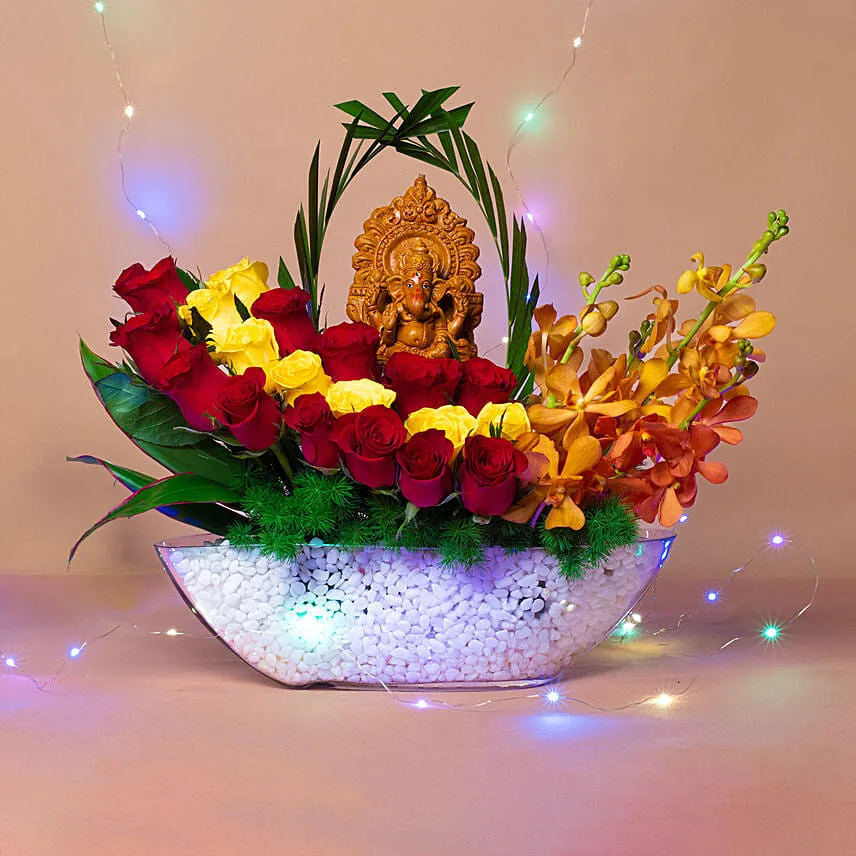Colourful Flowers N Ganesha Idol Ship Shaped Vase