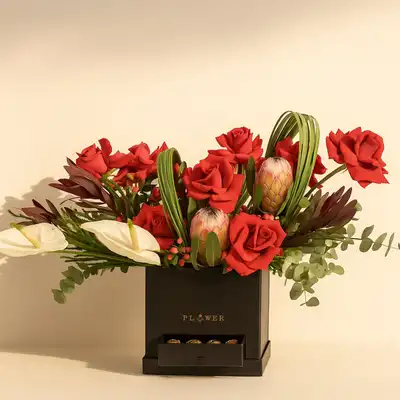 Elegant Radiant Roses and Anthurium Arrangement with Chocolates