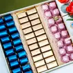 Elegant Floral Arrangement with Luxurious Chocolate Box