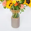 Warm Yellow Floral Elegance in a Luxury Brown Vase
