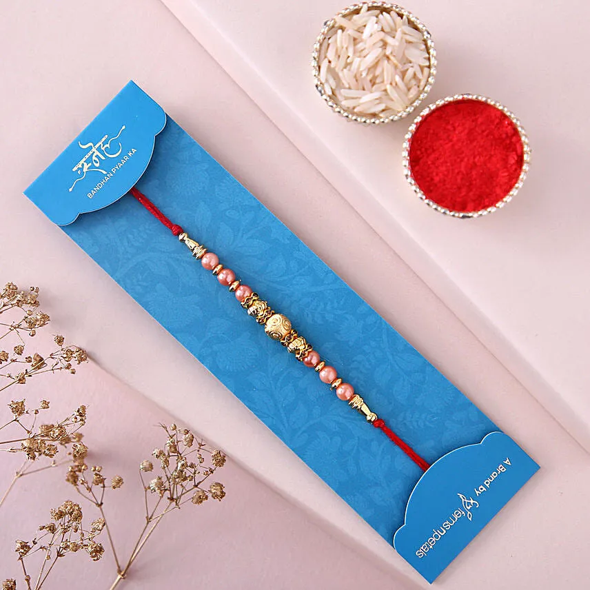 Sneh Rose Gold Rakhi & Ferrero Rocher